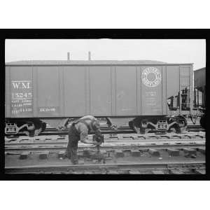  Photo Yardman polishing light on railroad switch. Elkins 