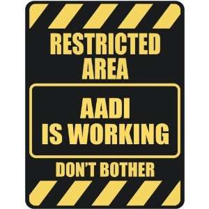   RESTRICTED AREA AADI IS WORKING  PARKING SIGN