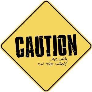   CAUTION  ACUÑA ON THE WAY  CROSSING SIGN