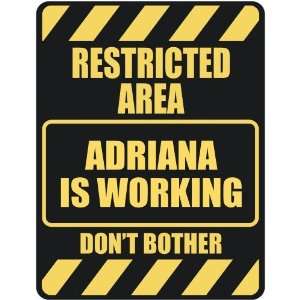   RESTRICTED AREA ADRIANA IS WORKING  PARKING SIGN