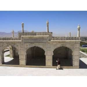  Reading the Koran Whilst Walking Round the White Marble Mosque Built 