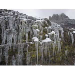  Icicles hanging from rock face at Logan Pass Photographic 