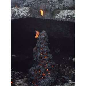  Cooling Pahoehoe Lava Drips over a Lichen Strewn Ledge 