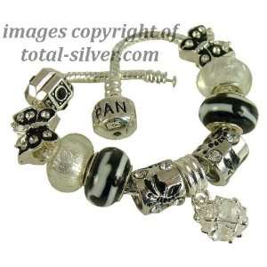 TOTAL SILVER 9 mixed Black and white theme beads and charms complete 