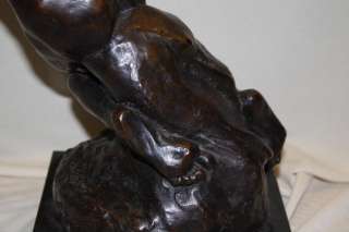 BRONZE SCULPTURE MAN SITTING TO THE SIDE SIGNED NOCQUER  