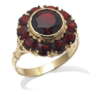    Ring in Yellow 925 Silver with Garnet, form Round, weight 4.4 grams
