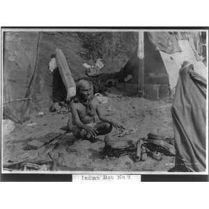  Indian Bob,squatting by camp fire in front of tent,1904 