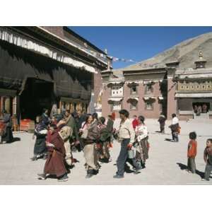  Pilgrims in Monastery Courtyard, Sakya, Tibet, China 