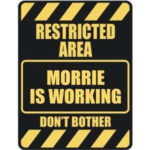   RESTRICTED AREA MORRIE IS WORKING  PARKING SIGN