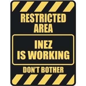   RESTRICTED AREA INEZ IS WORKING  PARKING SIGN