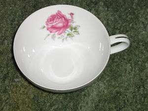   CHINA # 6702 I CUP WITH A RED ROSE IN THE CUP ITS 4 DIA & 2H  