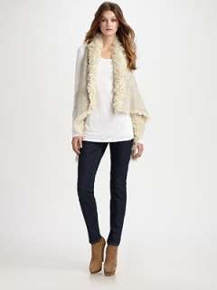   to hem Dyed goatskin shearling Dry clean Made in USA Fur origin Spain