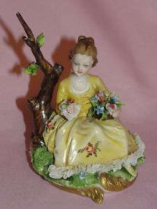 VINTAGE PORCELAIN GIRL WITH FLOWERS AND LACE FIGURINE  