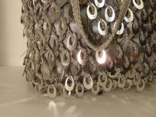 Silver crochet purse has silver dangles no name. Beautiful for evening 