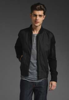 CHAMBERS Coated Cotton Bomber Jacket in Black/Black at Revolve 