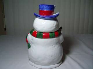 This is a Christmas time ceramic Snowman Cookie Jar. Sold in Bon Ton 