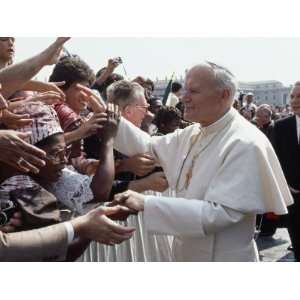  Pope John Paul II Greets a Crowd of People in St. Peters 