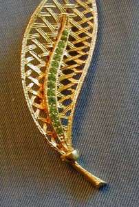GOLD TONE BASKET WEAVE LEAF PIN WITH PERIDOT COLORED CRYSTALS  